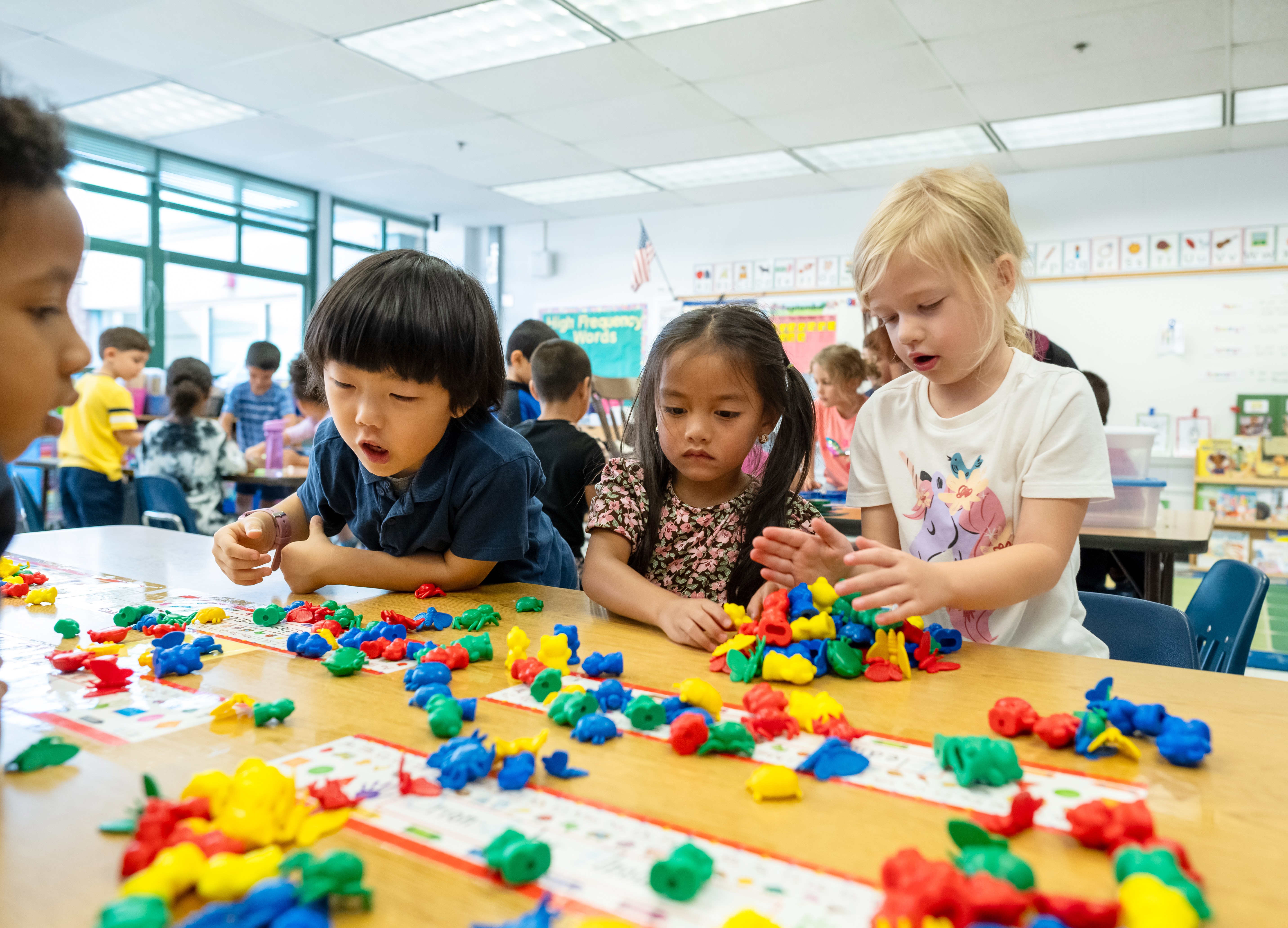 students sorting math manipulatives